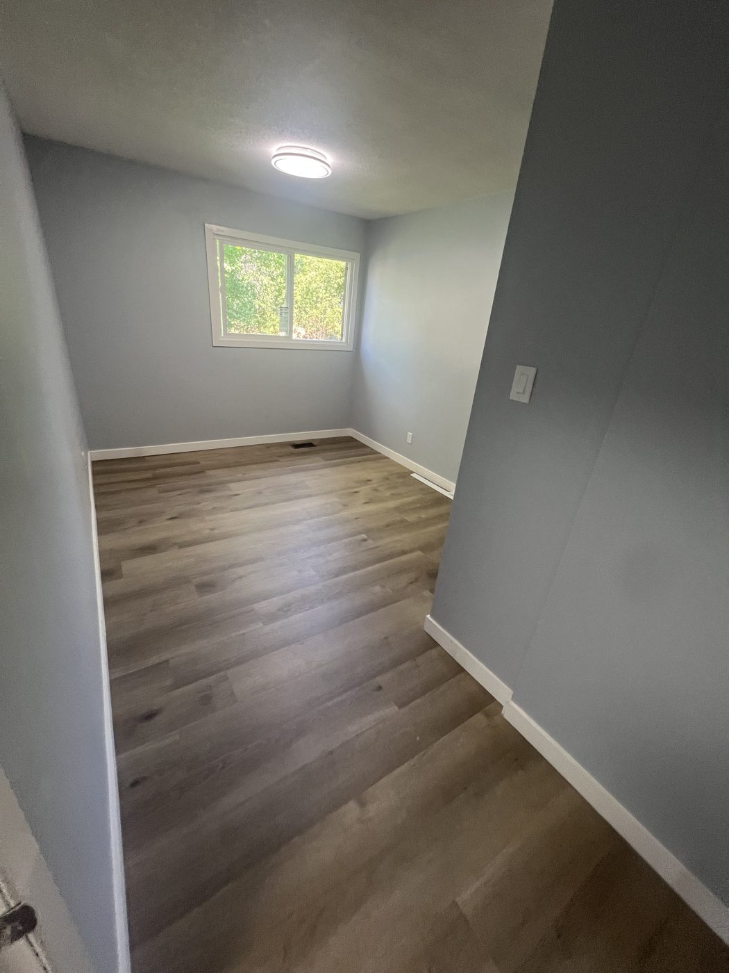 Bedroom with new plank flooring